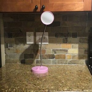 A pink adjustable lamp